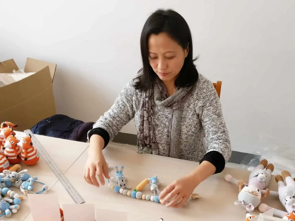 Quality control: owner Lynn measuring products at the inspection table.