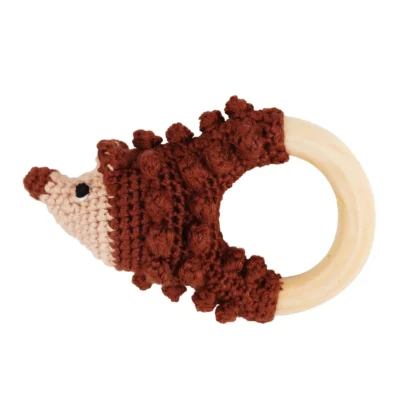 Hedgehog HARRY rattle ring with crocheted yarn surface and untreated beechwood ring, back view isolated