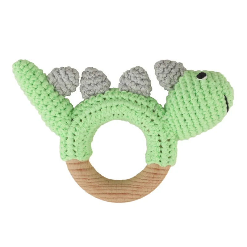 Rattle Ring Dinosaur DINO – Back View Dinosaur DINO rattle ring with crocheted yarn surface and untreated beechwood ring, back view isolated