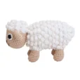 Handcrafted crochet cuddly toy sheep DOLLY made from organic cotton, side view