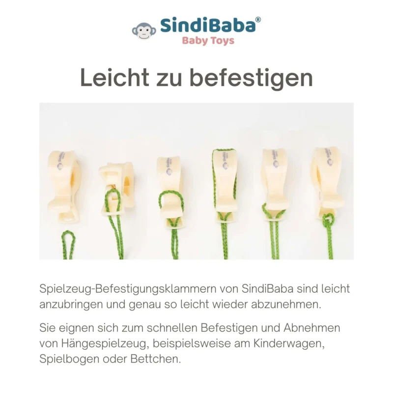 Anleitung – Schlaufe zur Klammer Schlaufe der Kinderwagenkette wird in eine hellbeige Befestigungsklammer eingefädelt.