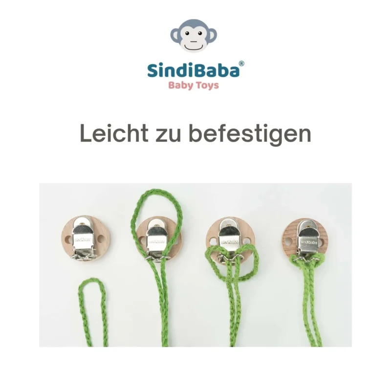Anleitung – Schlaufe zum Clip Schlaufe wird in den Holzclip der Kinderwagenkette eingefädelt.