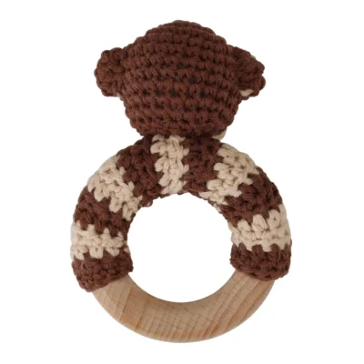Monkey ring rattle with tightly crocheted yarn and natural beechwood ring, back view isolated