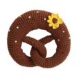 Crochet baby rattle pretzel with sunflower, front view
