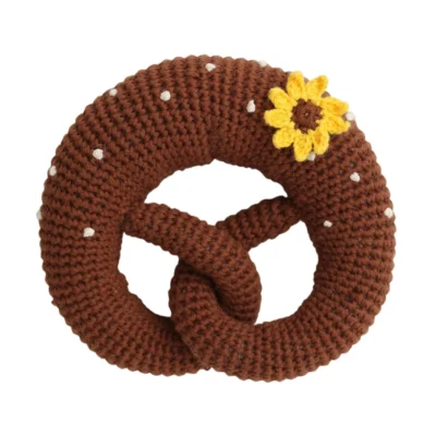 Crochet baby rattle pretzel with sunflower, front view