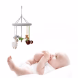 Collage of the crochet baby mobile SOUTH AMERICA with a baby lying on its back looking up intently